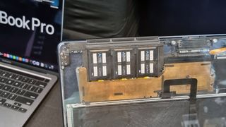 Three Frore Airjet Mini Slims mounted in an Apple Macbook Pro with a transparent panel